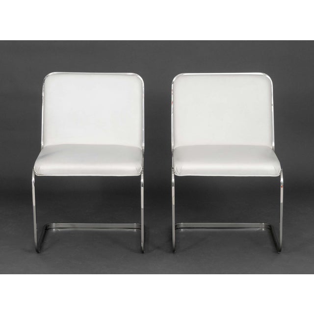 Pair of Brueton Chrome Cantilevered Side Chairs, in the style of Mies van der Rohe Brno chair, with faux white leather...