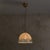 An Italian glass dome pendant from the 1970s, defined by its softly graphic surface. The shade is blown in clear glass and...