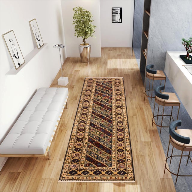 Enhance the ambiance of your home with this magnificent Persian-influenced Turkish hand-knotted rug made by skilled...
