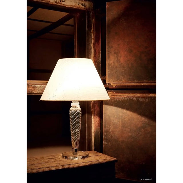 Table lamp with Murano glass column, grey/white spiral transparent glass base, a truncated cone-shaped fabric shade, and...