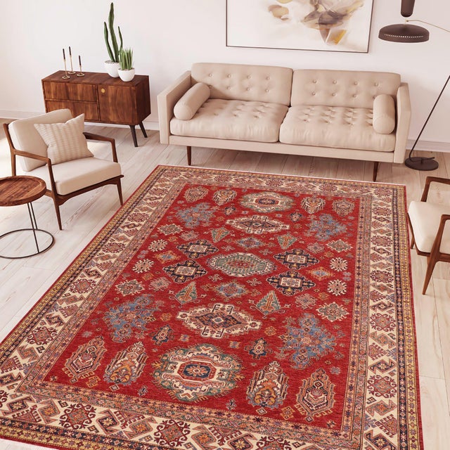 Enhance your home with this exquisite hand-knotted Super Kazak rug, crafted from fine hand-spun wool and dyed with all-...