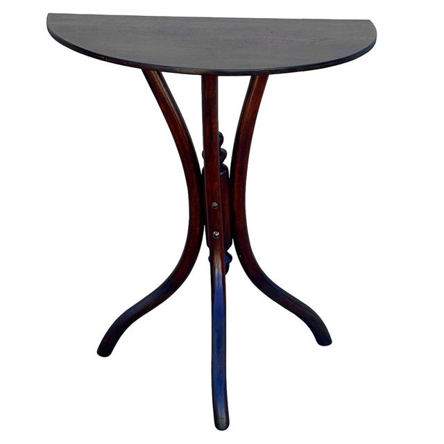 Late Victorian oak console table by Thonet features a three tripod legs richly grained solid wood. The design is defined...