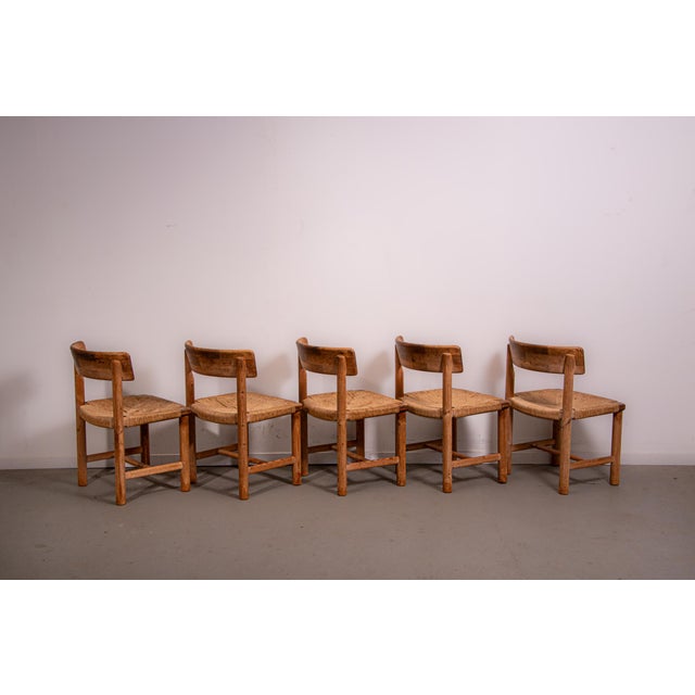 Set of 5 dining chairs designed by Ranier Daumille. Mede from Danish pine and Chord in Denmark in the 1980s. The chairs...