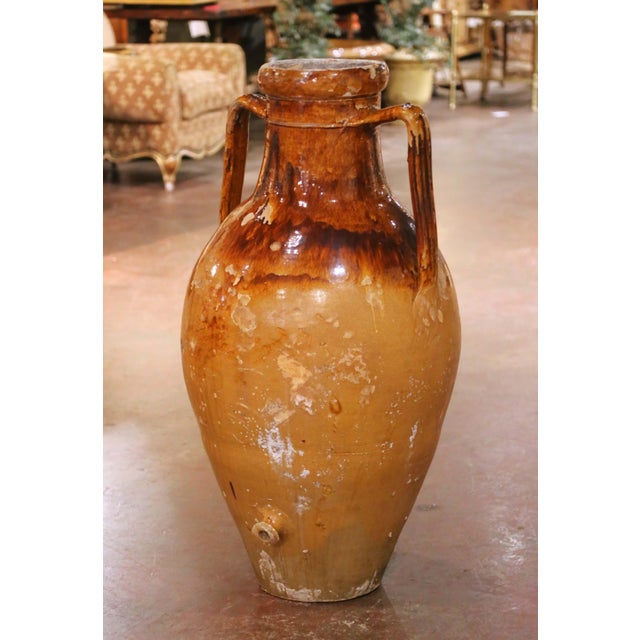 This impressive antique French terracotta olive oil jar was crafted in Provence, southern France, circa 1860. Monumental...
