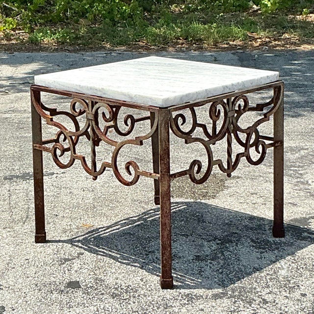 This vintage side table effortlessly blends rustic elegance with timeless design. The hand-wrought iron base features...