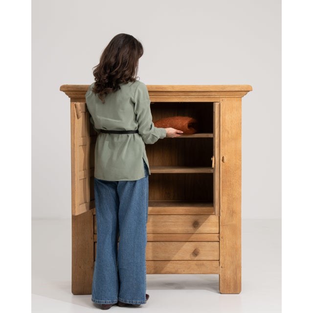 A substantial oak buffet exemplifying the bold aesthetics of the Brutalist movement. The heavy proportions and textured...
