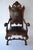 Impressive mid-19th century Italian Baroque style throne armchair, hand carved in walnut with dark leather upholstery. The...