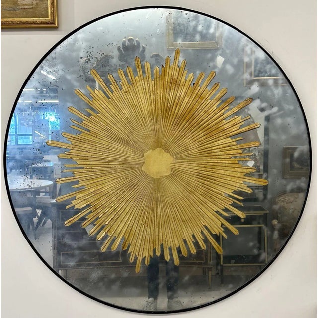 Hollywood Regency Style, Modern Round Sunburst Mirrors, Distressed Glass, 21st c. A pair of carved gilt gold and silver...