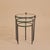 A trio of French round nesting tables by Jacques Adnet dating back to the 1950s, crafted in patinated metal with...