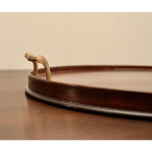 Lovely large scale Victorian period George III style mahogany tray with inlaid urn design. With two brass handles. The...