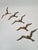 An impressive set of five wall decorations in the form of flying seagulls, made of brass. The dynamic, minimalist form...