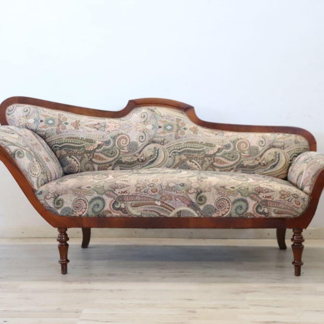 Antique Italian sofa or chaise longue dating back to the mid-19th century. The sofa features a solid walnut frame and a...