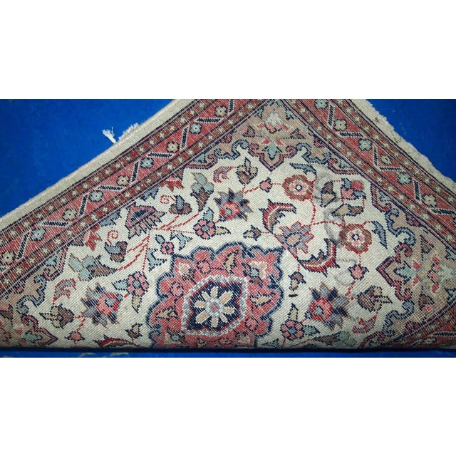 Vintage handmade Indian rug from the end of 20th century. The rug is in original good condition in a beige shade and...
