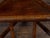 This English Turn of the Century oak corner chair, dating back to circa 1900, features a carved geometric back splat,...