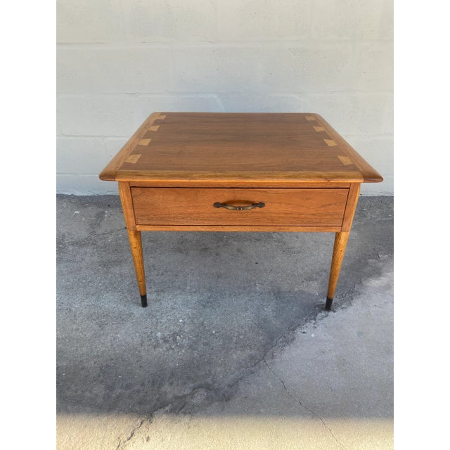 Mid-century modern side table with single drawer. Acclaim Series by Lane Furniture. Classic dovetail detail at tabletop....