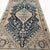 This elegant antique Qashqai rug, handwoven over 100 years ago, showcases a beautifully balanced composition with a...