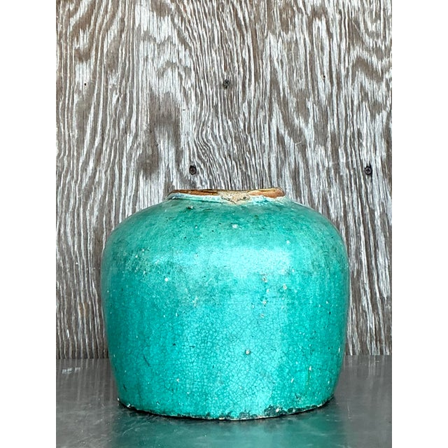 Elevate your space with this striking vintage Asian glazed ceramic jar, featuring a bold turquoise hue and captivating...