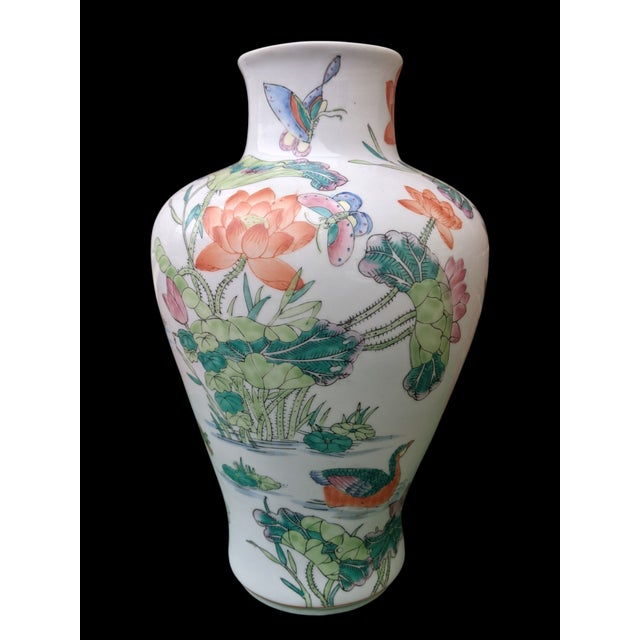 This Vintage "Qianlong" marked porcelain vase is a beautiful addition to any collection. The delicate famille verte hand...