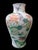 This Vintage "Qianlong" marked porcelain vase is a beautiful addition to any collection. The delicate famille verte hand...