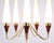 Five-arm chandelier designed by Bent Karlby and manufactured by Lyfa in the 1960s. The lamp features a brass and teak...