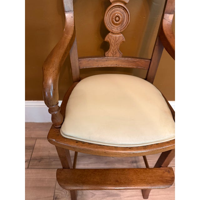 Antique Eastlake Victorian Style Carved Child’s High Chair with a built in foot rest, original seat was caned apparent by...
