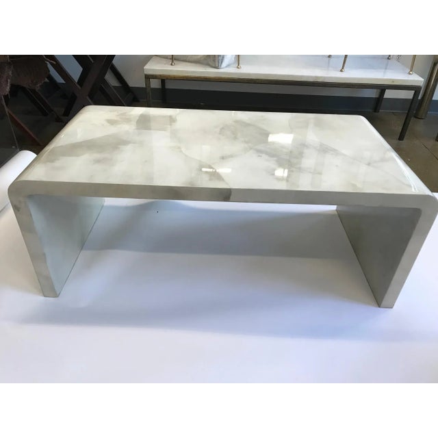 Exquisite natural goat parchment water fall table in the style of Jean Michel Frank. Heavy resin finish provide extreme...