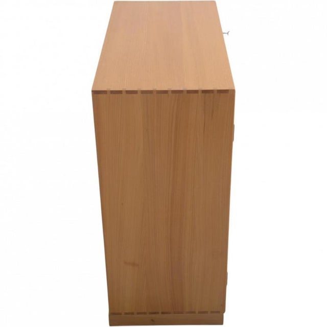 Mogens Koch cabinet made of elm, and from the 1970s. The cabinet appears in good condition with a few marks and scratches....