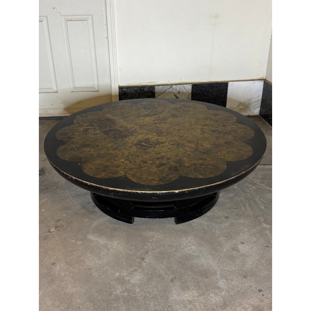 Designed by Theodore Muller and Isabel Barringer for Kittinger, this striking circular cocktail table—known as the...