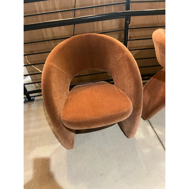 Sweeping curves and COMFORT! These chairs ergonomically fit the body. They are incredibly stylish and sculptural as well....