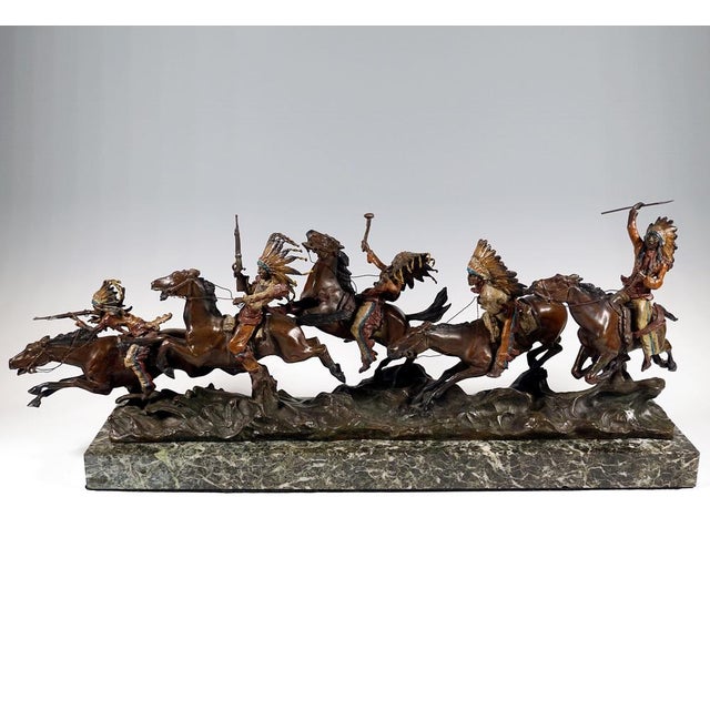Excellent piece of viennese bronze art around 1920: five native americans in war dress, armed with rifles, axes and...
