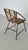 Woven rattan lounge chair, Italian design. Fits perfectly into a minimalist 1960s lounge setting. Matte black metal base.