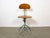 This industrial height adjustable, rotating chair was made in former Czechoslovakia during the 1950s.It features a green...