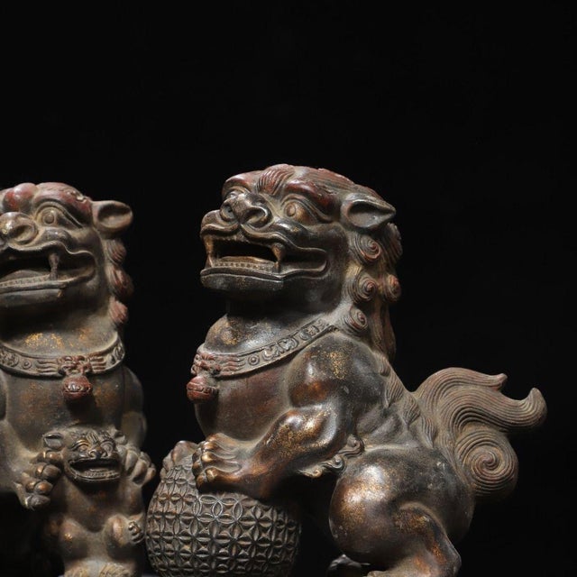 Bronze Pair of Vintage Chinese Gilt Bronze Foo Dogs – Buddhist Guardian Lions With Brocade Ball For Sale - Image 8 of 11