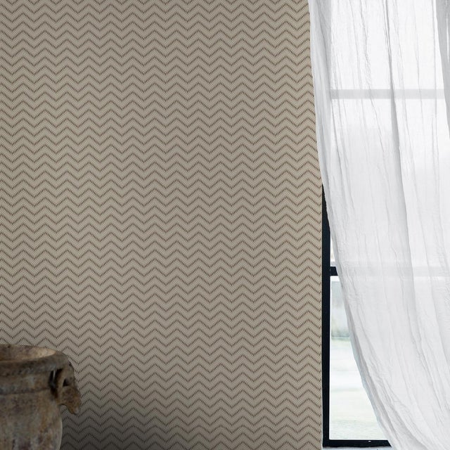 Chevron Dots in silver is a wildly chic wallpaper pattern consisting of wavy, zigzagging lines that appear to move...
