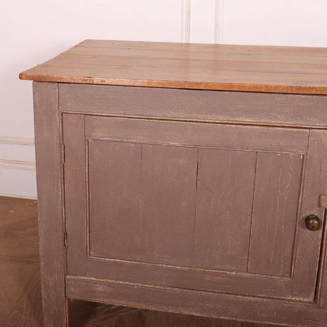 19th C English 2 door painted pine buffet. 1890 This piece is designed in the style of the selected designer and/or...