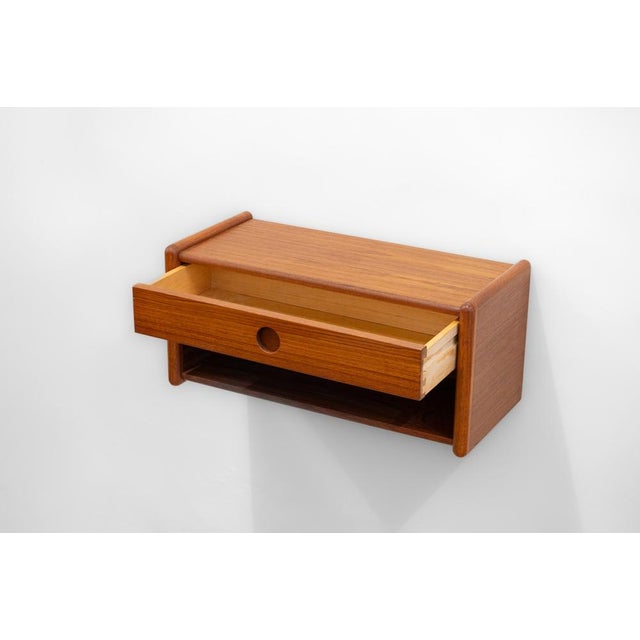 Wall-mounted night cabinet in teak. Designed and manufactured in denmark in the 1960s by vildbjerg møbelfabrik. This...