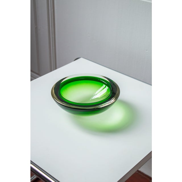 Elegant Murano glass trinket bowl with a beautiful gradient of green. Its round, organic shape and subtle color nuances...