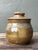 This exquisite hand-thrown studio pottery lidded jar is a masterclass in the organic beauty and tactile expression of late...
