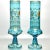 A pair of stunningly beautiful hand blown transparent turquoise glass vases, embellished with prunts and polychrome floral...