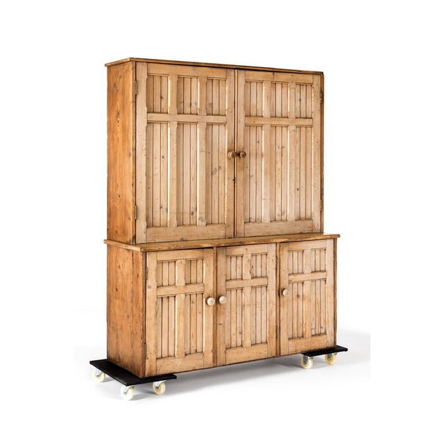 A large Victorian House keepers cupboard, with an arrangement of two tall cupboards with three cupboards beneath. All...