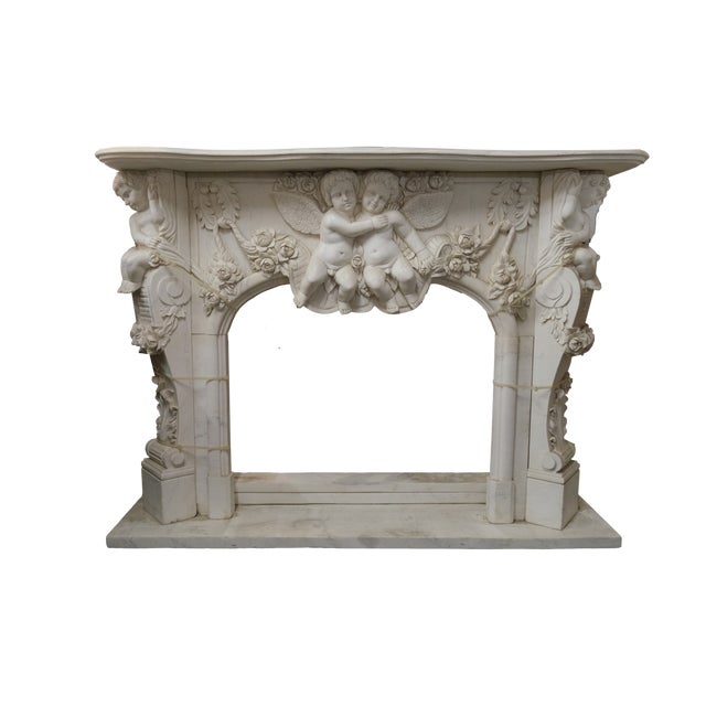 Type: Antique fireplace carved with cherubs; Style: Neo-Baroque with Rococo influences; Period: Early 1900s; Origin:...