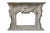 Type: Antique fireplace carved with cherubs; Style: Neo-Baroque with Rococo influences; Period: Early 1900s; Origin:...