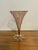 Lovely pink vase with a swirl motif on the body. Clear sunburst footing with a pontil mark on the bottom, indicating the...