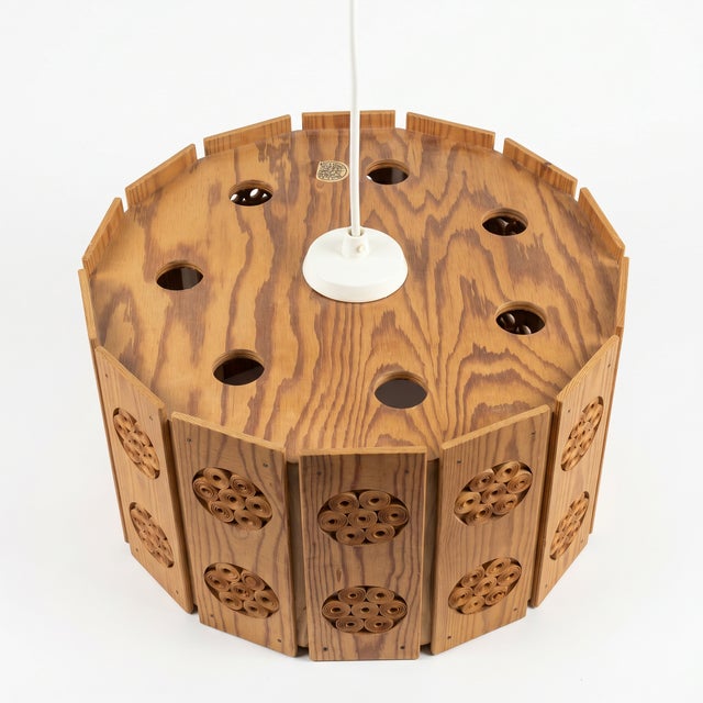 A sculptural Swedish ceiling pendant from the 1970s, signed Byalaget — a traditional Swedish craft workshop whose name...