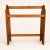 A freestanding pine quilt rack with three rails and gently scalloped side panels on cutout feet. It's the classic country...