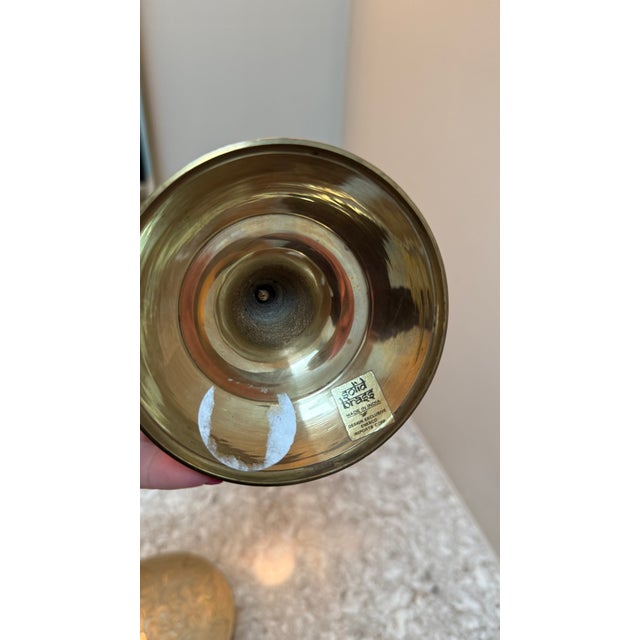 intage solid brass pricket candlestick, made in India. Features a classic pedestal form with a wide drip tray and central...