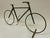 This handcrafted tabletop bicycle sculpture brings an elegant layer of vintage industrial character to any mid-century...