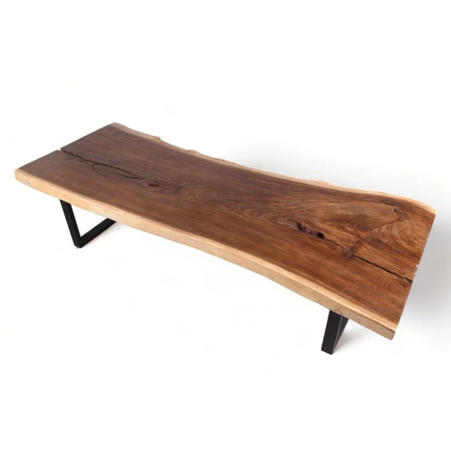 Crafted from a single, majestic slab of wood spanning an impressive 98 inches in length, this exquisite table embodies...
