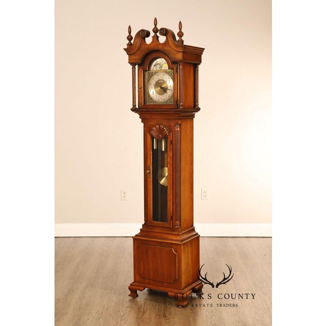 High Quality American Made Howard Miller Chippendale Style Grandfather Clock Constructed In Cherry With Bonnet Top And...