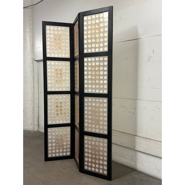 Design Plus Gallery presents a Shell Three Panel Folding Screen from Shawna Stoney. The black wood frame is divided into...